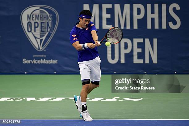 Kei Nishikori of Japan returns a shot to Ryan Harrison of the United States during their singles match on Day 3 of the Memphis Openat the Racquet...