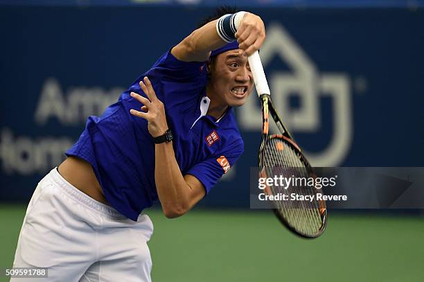 Kei Nishikori of Japan serves to Ryan Harrison of the United States during their singles match on Day 3 of the Memphis Open at the Racquet Club of...