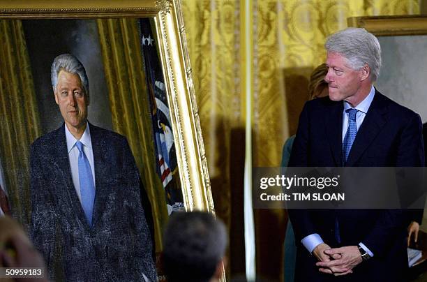 Former US President Bill Clinton views his offical White House portrait which will be hung on the West wall of the Grand Foyer during the unveiling...