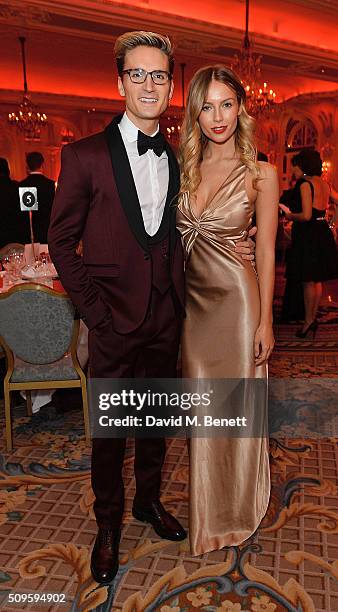 Ollie Proudlock and Emma Connolly attend a drinks reception during the British Heart Foundation: Roll Out The Red Ball at The Savoy Hotel on February...