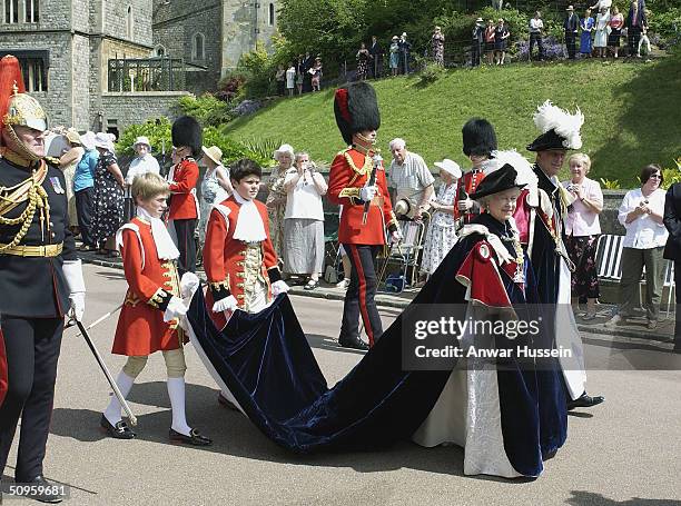 Queen Elizabeth II and her husband Prince Philip Duke of Edinburgh attend the Order of the Garter service in St George's chapel on June 14, 2004 in...