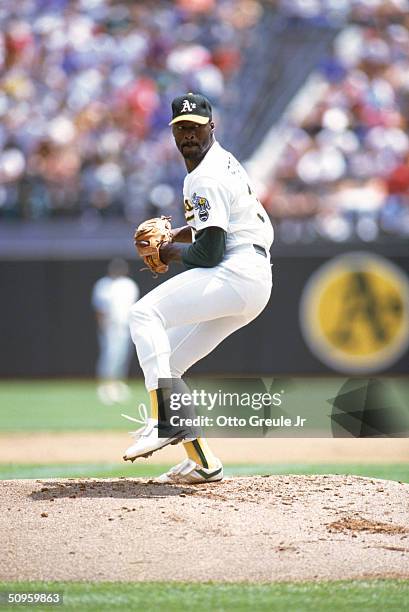 Pitcher Dave Stewart of the Oakland Athletics pitches during the 1990 season at Oakland Alameda County Stadium in Oakland, California.