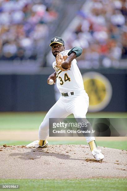 Pitcher Dave Stewart of the Oakland Athletics pitches during the 1990 season at Oakland Alameda County Stadium in Oakland, California.