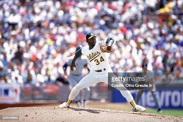 Pitcher Dave Stewart of the Oakland Athletics delivers a pitch during a game against the New York Yankees in the 1990 season at Oakland Alameda...