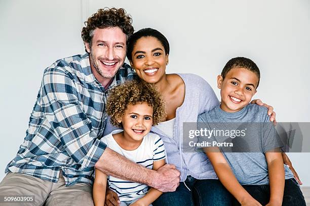 happy multi-ethnic family at home - famiglia con due figli foto e immagini stock
