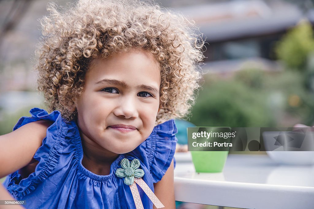Cute girl smiling at yard