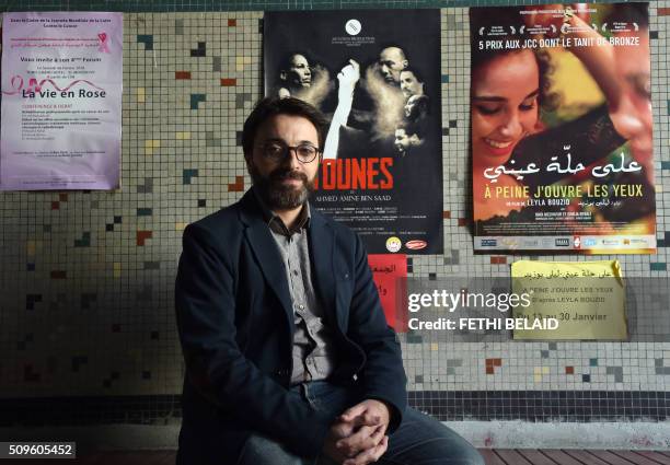 Tunisian director Mohamed Ben Attia poses during a photo shoot at a movie theatre in Tunis on January 29, 2016. Ben Attia's film "Inhebbek Hedi" , a...