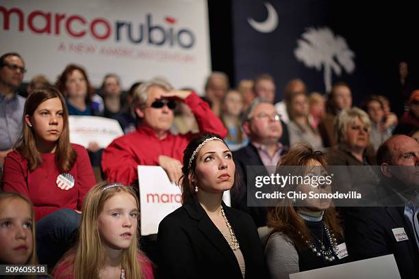 Students and their family members and guests listen to Republican presidential candidate Sen. Marco Rubio during a campaign town hall meeting at the...