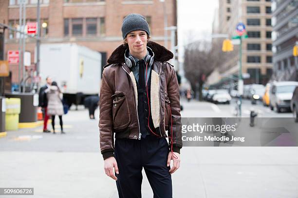 Zach King wears a cropped vintage brown leather jacket with shearling lining, J. Crew Suit, and Paul Smith during New York Fashion Week: Men's...