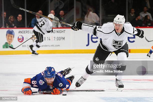 Mikhail Grabovski of the New York Islanders falls to the ice as Brayden McNabb of the Los Angeles Kings skates for the puck during the game at the...