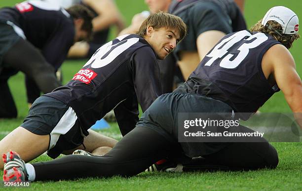 Matthew Lappin and Anthony Koutoufides have a discussion during a Carlton training session at Optus Oval, on June 15, 2004 in Melbourne, Australia.