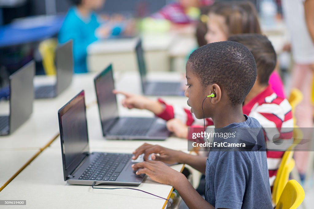 Children Learning How To Use Laptops High-Res Stock Photo - Getty Images