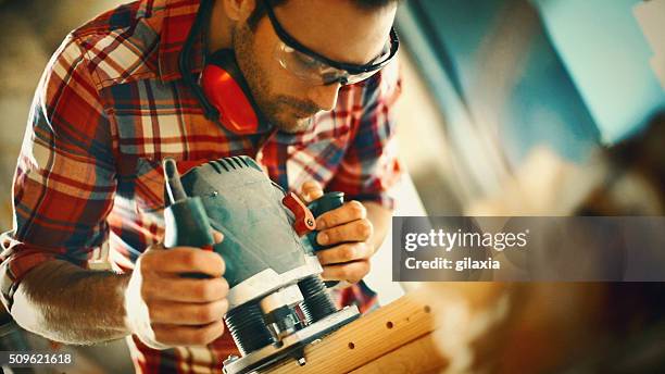 carpentry workshop routine. - elektrisch gereedschap stockfoto's en -beelden