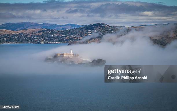 Cloudy day in San Francisco with fog around Alcatraz.