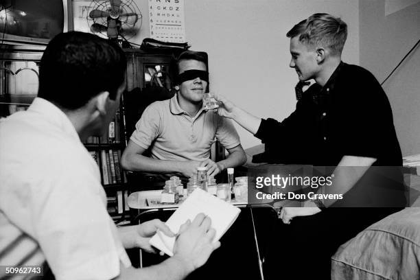 During a sleep deprivation experiment, American student Bruce McAllister takes notes while Randy Gardner describes scents offered to him by Joe...