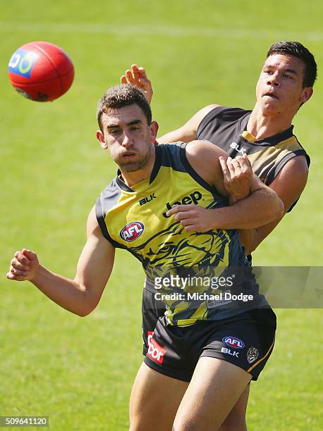 Daniel Rioli of the Tigers tackles Adam Marcon of the Tigers during the Richmond Tigers AFL intra-club match at Punt Road Oval on February 12, 2016...