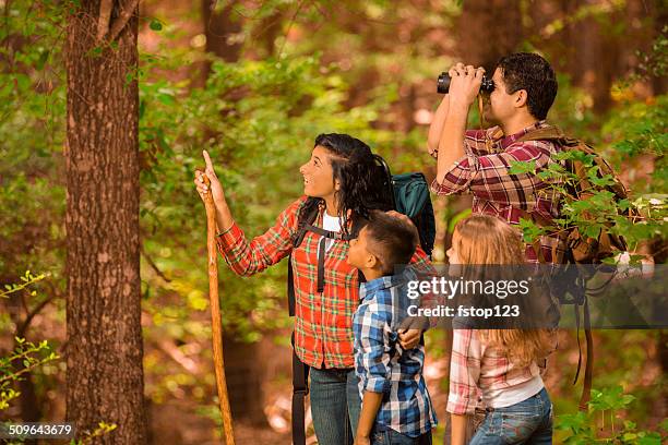 Multiethnic Family Hiking Backpacking Outdoors In National Park Area High-Res Stock Photo