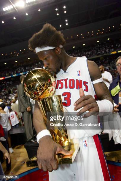 Ben Wallace of the Detroit Pistons celebrates after winning the Championship as he kiss the Larry O'Brien trophy in Game five of the 2004 NBA Finals...