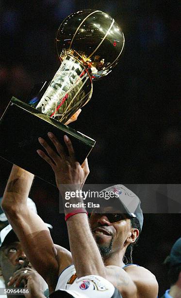 Richard Hamilton of the Detroit Pistons celebrates with the Larry O'Brien NBA Championship trophy after defeating the Los Angeles Lakers 100-87 in...
