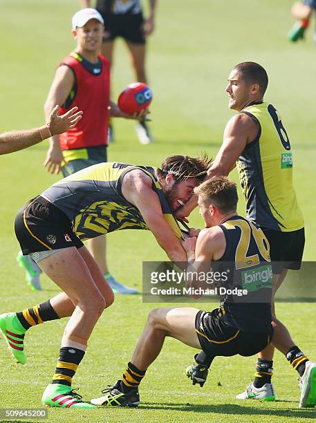 Anthony Miles of the Tigers and Liam McBean of the Tigers wrestle on during the Richmond Tigers AFL intra-club match at Punt Road Oval on February...