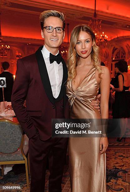 Ollie Proudlock and Emma Connolly attend a drinks reception during the British Heart Foundation: Roll Out The Red Ball at The Savoy Hotel on February...