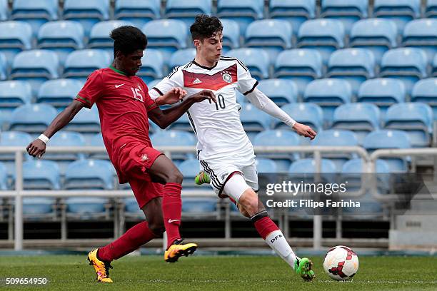 Thierry Correia of Portugal challenges Kai Havertz of Germany during the UEFA Under17 match between U17 Portugal v U17 Germany on February 9, 2016 in...