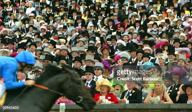 Race goers cheer as Frankie Dettori rides Kheleyf to victory in the first race during the second day of Royal Ascot at Ascot Racecourse on June 16,...