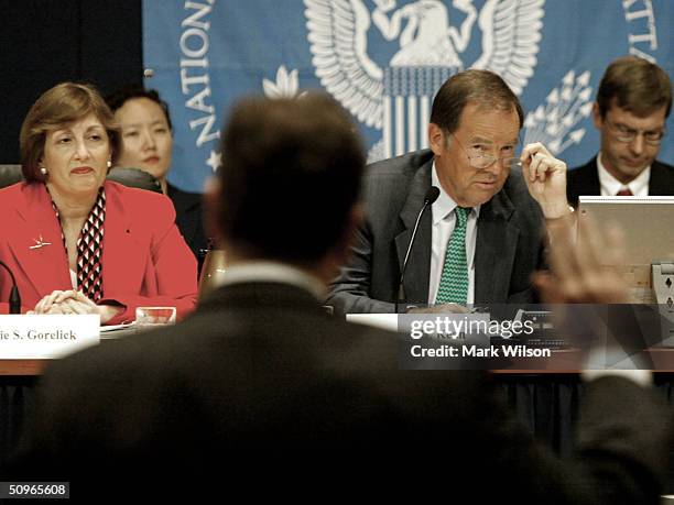 Commissioner Chairman Thomas H. Kean and Jamie S. Gorelick swear in a group of witnesses during a 9-11 Commission hearing June 16, 2004 in...