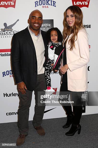 Tiki Barber and Traci Lynn-Johnson and their daughter attend Nike/Levi's Kids Rock! Runway Show on February 11, 2016 in New York City.
