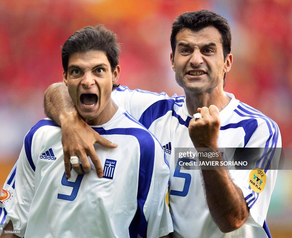 Greece's forward Angelos Charisteas (L)