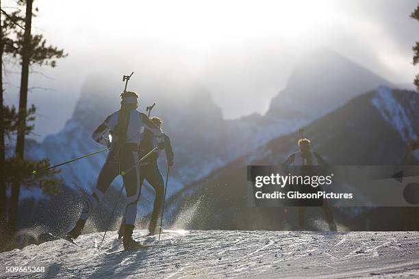 biathlon ski racers - biathlon ski stock pictures, royalty-free photos & images