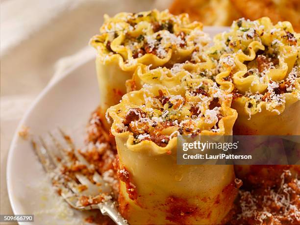 lasagna rolls with beef, spinach and ricotta - serving lasagna stock pictures, royalty-free photos & images