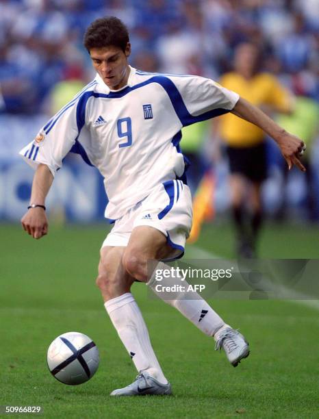 Greece's forward Angelos Charisteas controls the ball, 16 June 2004 at Bessa stadium in Porto, during his team's Euro 2004 group A football match at...