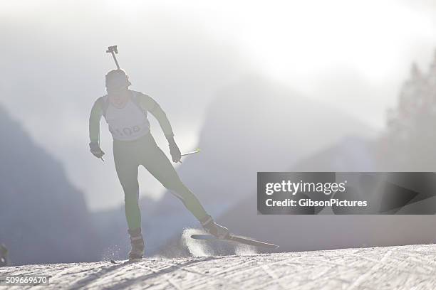 biathlon ski racer girl - biathlon ski stock pictures, royalty-free photos & images