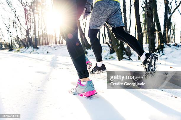 healthy way of life - winter running stock pictures, royalty-free photos & images