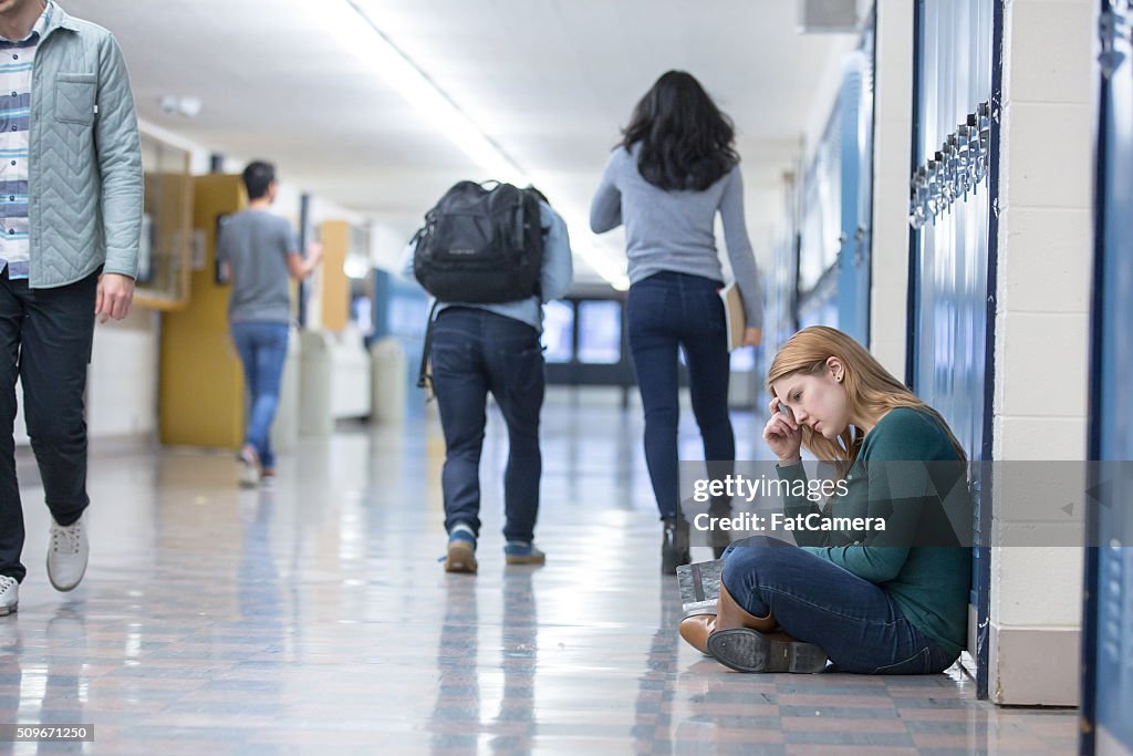 Student getting bullied in school hallway