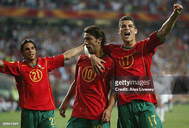 Rui Costa of Portugal celebrates with Ronaldo after scoring the second goal during the UEFA Euro 2004, Group A match between Russia and Portugal at...