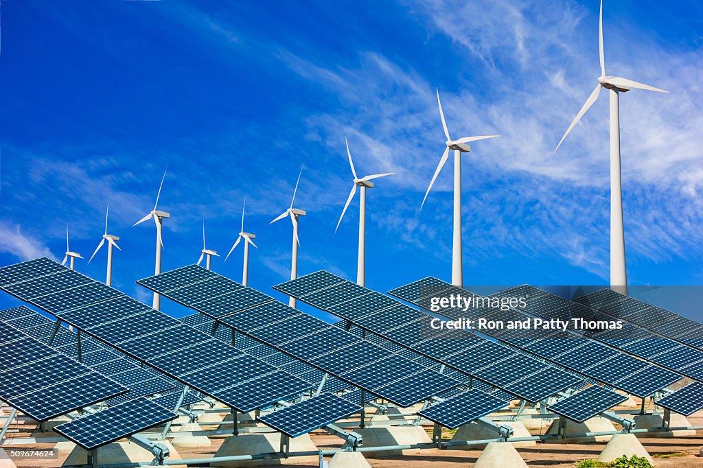 Wind turbines and solar panels making green energy