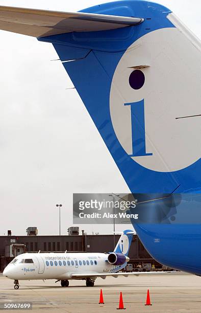 Two Independence Air planes are seen on June 16, 2004 at Dulles Airport in Virginia outside Washington, DC. Low-fare U.S. Carrier Independence Air, a...