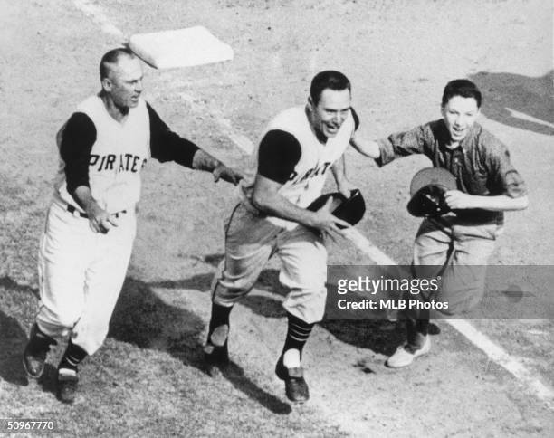 Bill Mazeroski of the Pittsburgh Pirates celebrates as he runs home after hitting a walk off home run in the bottom of the ninth in Game 7 of the...