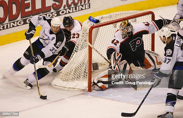 Left wing Fredrik Modin of the Tampa Bay Lightning attempts to score on goalie Robert Esche of the Philadelphia Flyers in Game six of the 2004 NHL...
