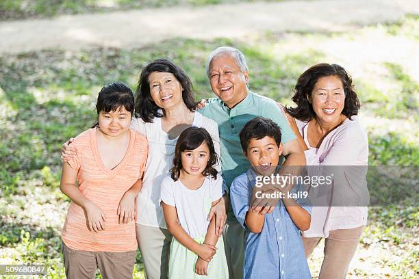 multi-generation asian family with autistic daughter - autism adult stock pictures, royalty-free photos & images