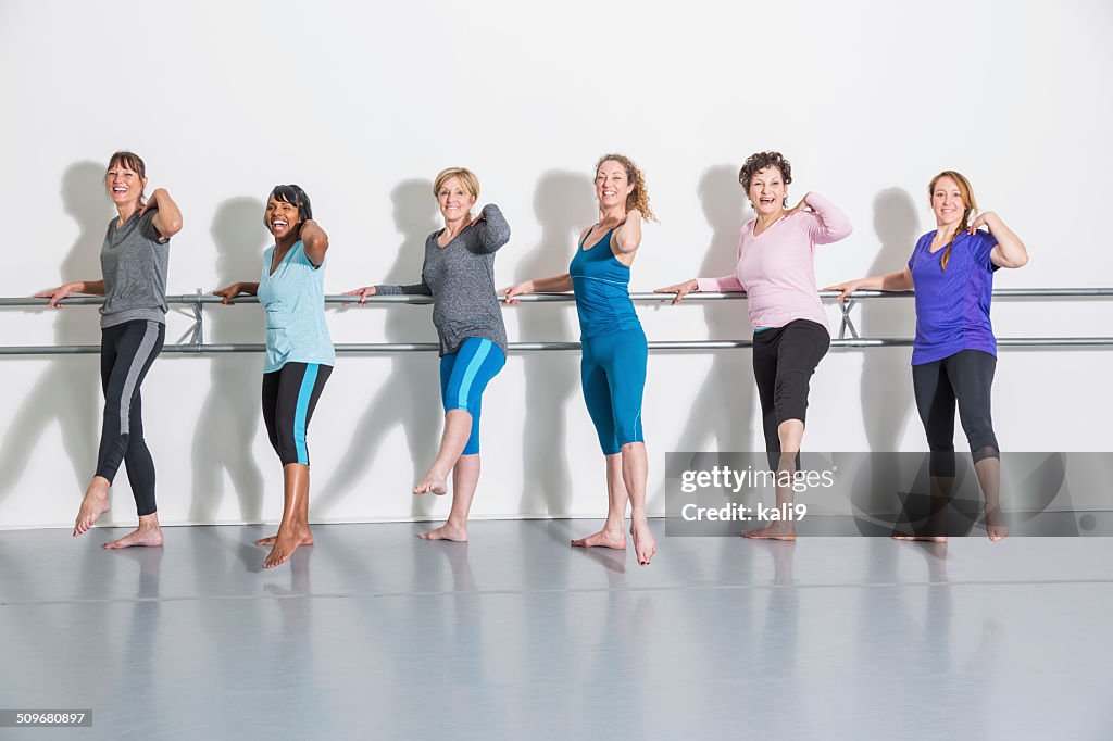 Women doing barre exercises