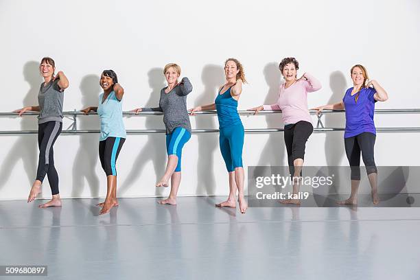 women doing barre exercises - people in a line stock pictures, royalty-free photos & images