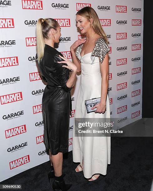 Fashion models Candice Swanepoel and Karlie Kloss attend the Marvel cover release event with Garage Magazine on February 11, 2016 in New York City.