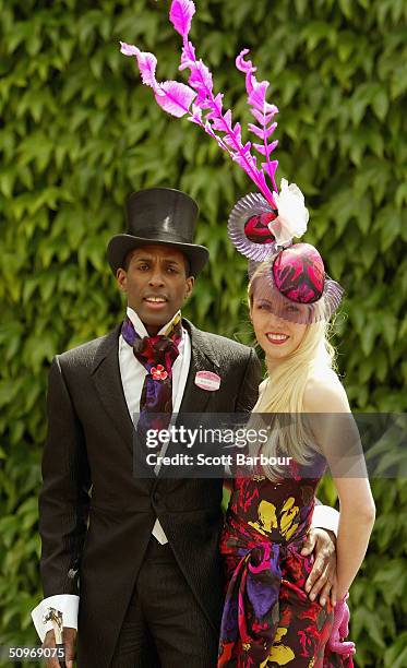 Couple attend Ladies Day on the third day of Royal Ascot at the Ascot Racecourse on June 17, 2004 in Berkshire, England. The event has been one of...