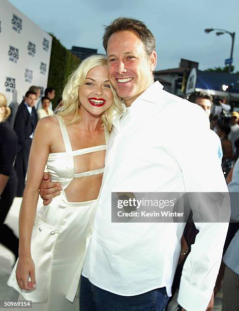 Actress Jaime King and Revolution's Todd Garner pose at the premiere of Revolution Studio's and Columbia Picture's "White Chicks" at the Village...