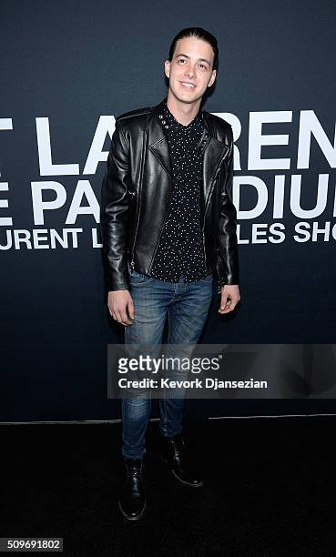 Actor Israel Broussard attends the Saint Laurent show at The Hollywood Palladium on February 10, 2016 in Los Angeles, California.