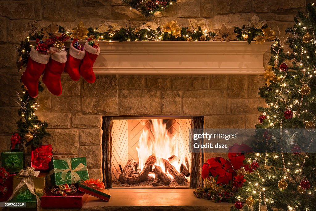 Christmas fireplace, stockings, gifts, tree, copy space