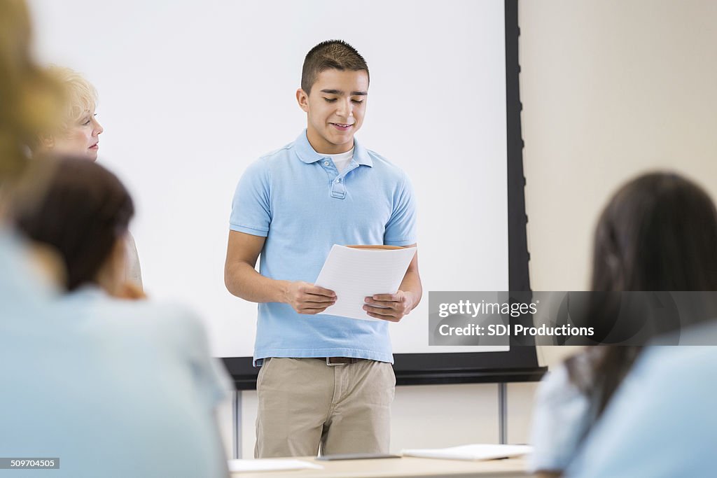 Nervous teen student giving presentation in front of class